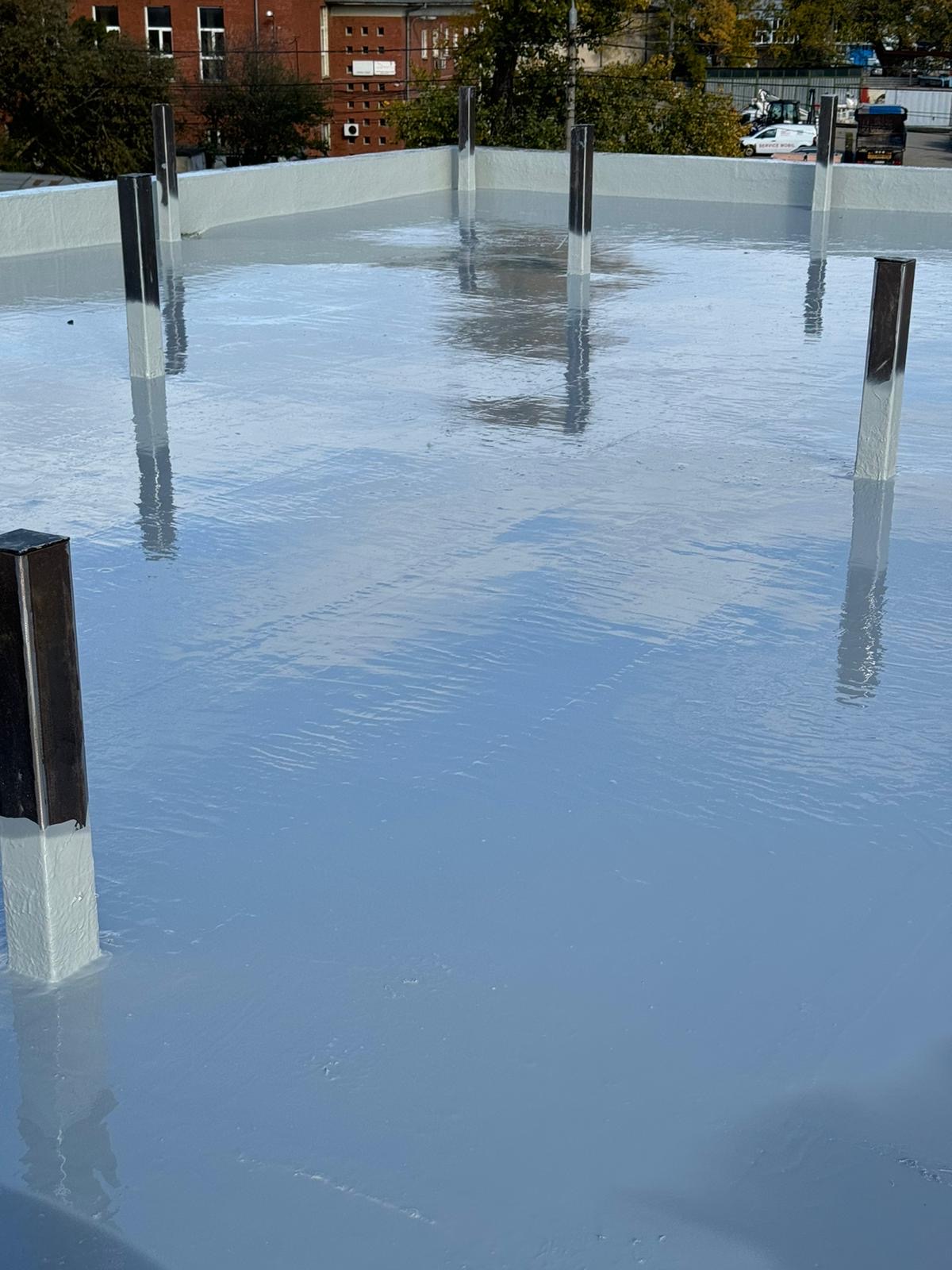 Terraza con membrana poliuretánica armada de acabado gris